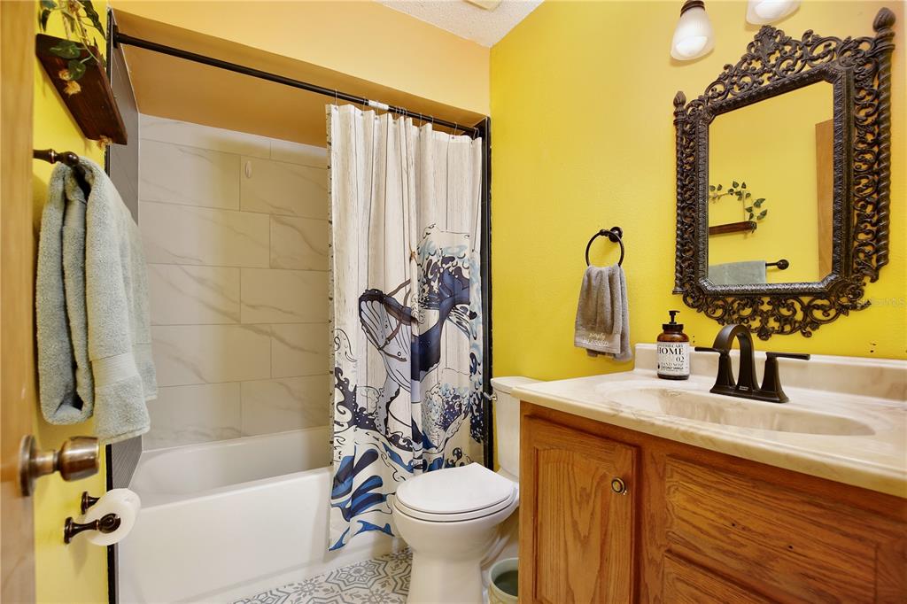 425 Mercers Fernery Road DeLand, FL 32720 - Photo 22 of 54 a bathroom with a sink toilet and shower