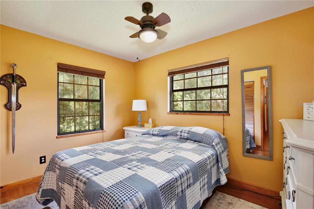 425 Mercers Fernery Road DeLand, FL 32720 - Photo 23 of 54 a bedroom with a bed and a window
