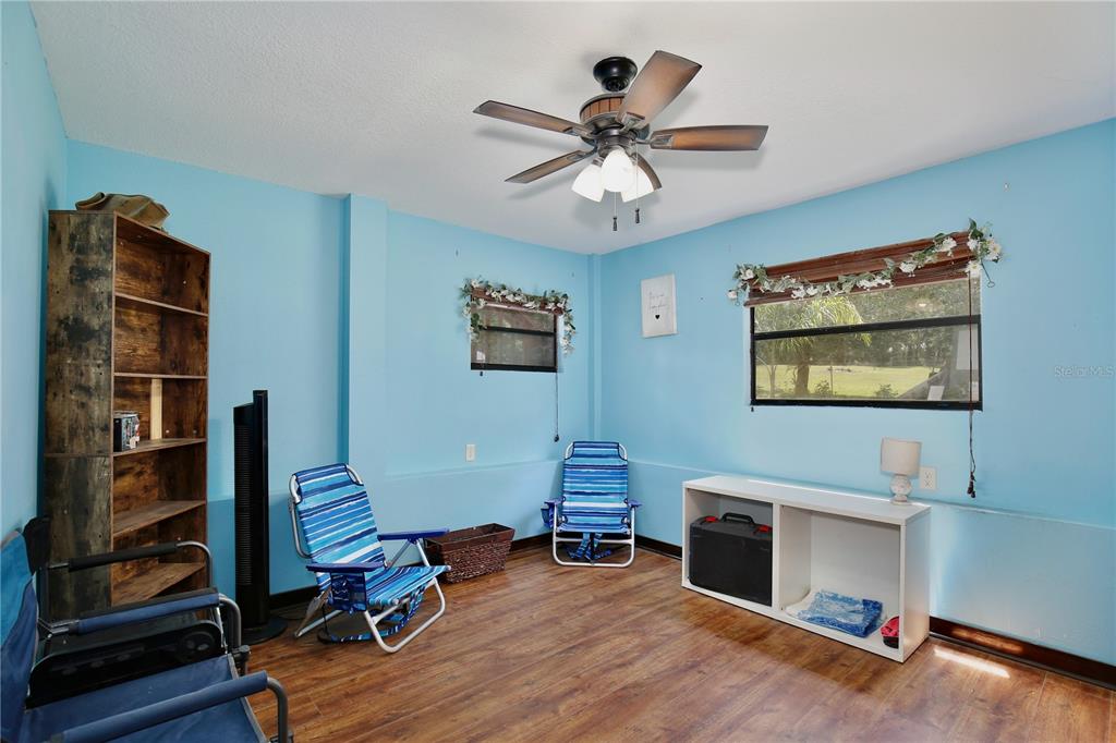 425 Mercers Fernery Road DeLand, FL 32720 - Photo 30 of 54 a living room with furniture and a fireplace