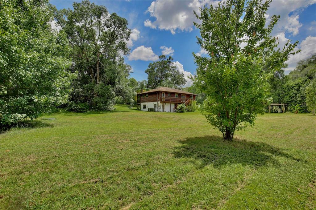 425 Mercers Fernery Road DeLand, FL 32720 - Photo 36 of 54 a view of an outdoor space and a yard