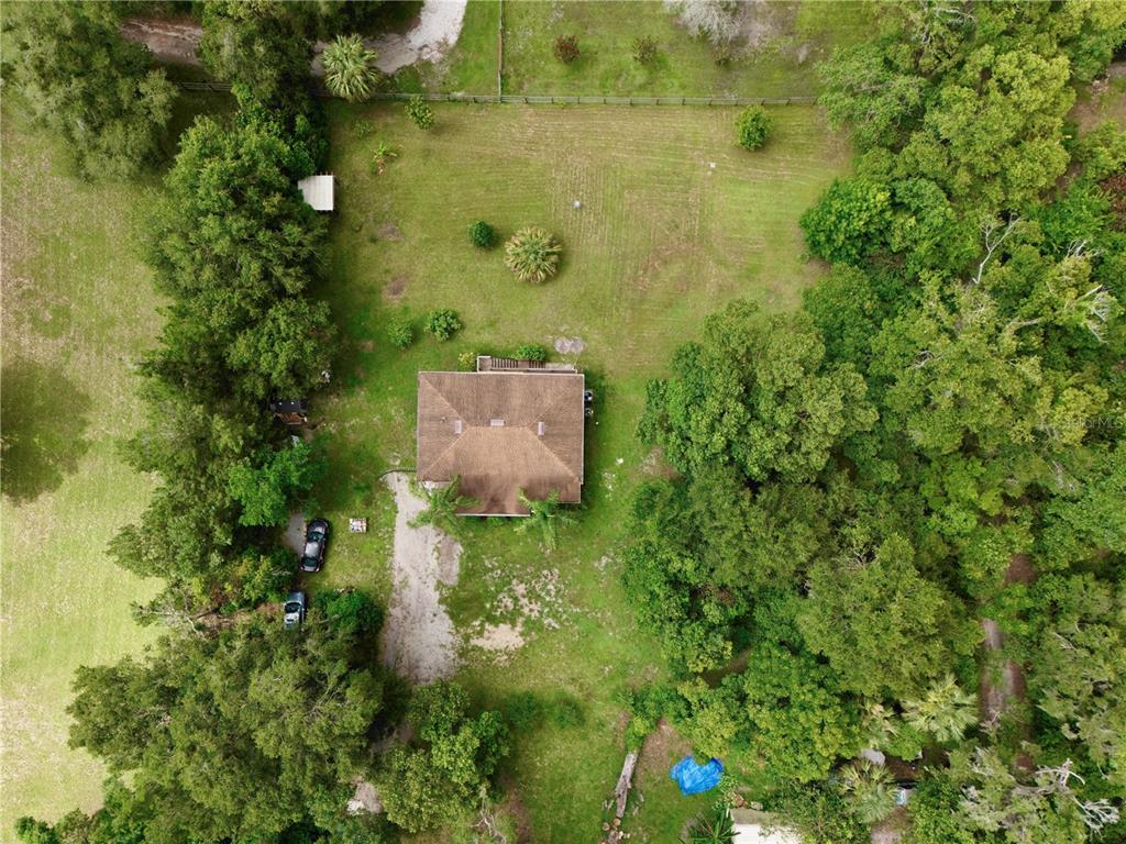 425 Mercers Fernery Road DeLand, FL 32720 - Photo 42 of 54 an aerial view of residential house with outdoor space and trees around