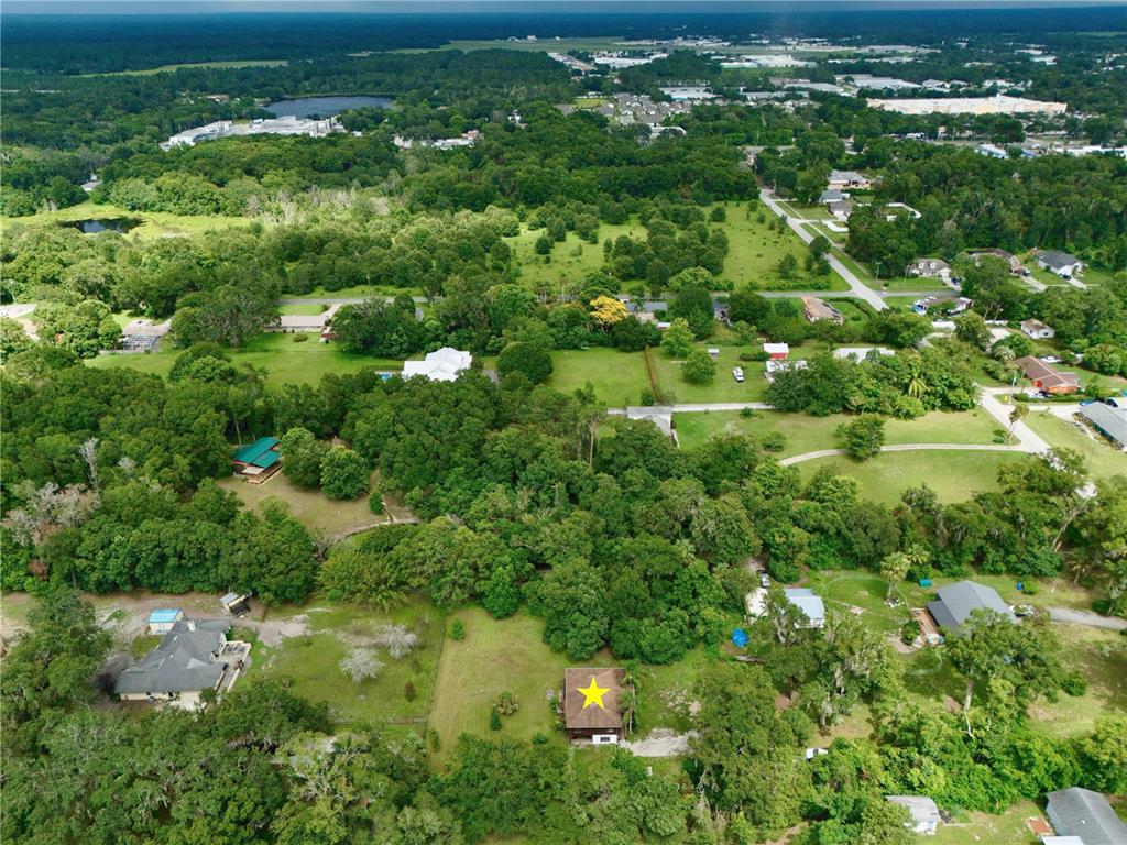 425 Mercers Fernery Road DeLand, FL 32720 - Photo 47 of 54 an aerial view of residential houses with outdoor space and trees
