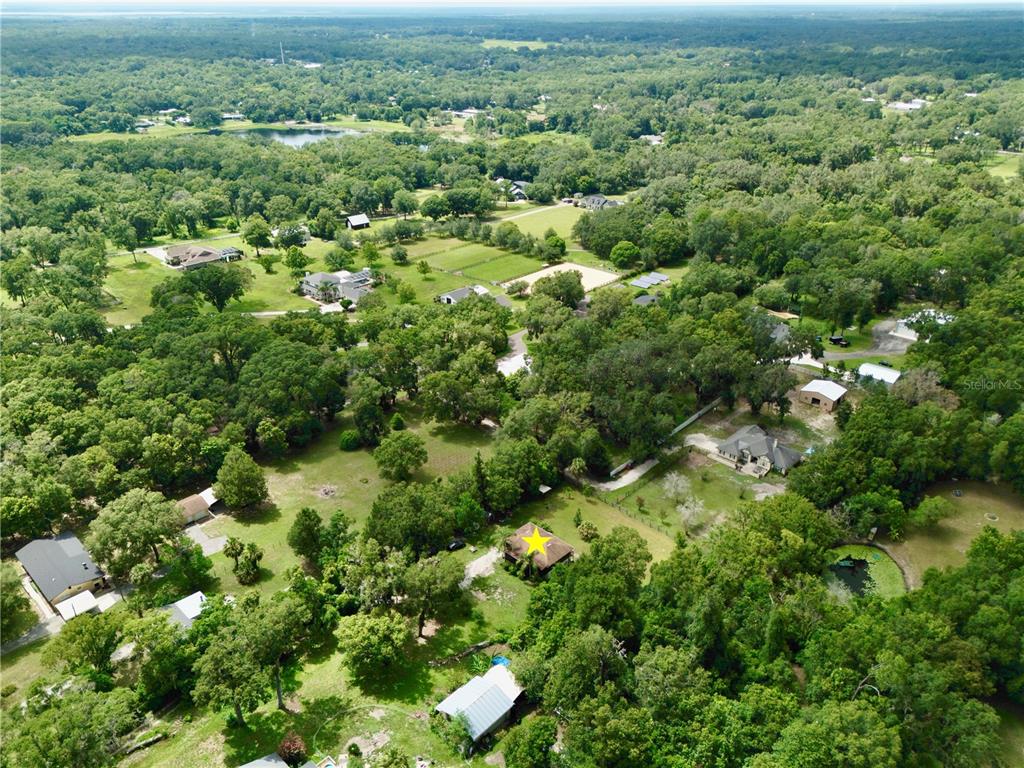 425 Mercers Fernery Road DeLand, FL 32720 - Photo 54 of 54 an aerial view of residential houses with outdoor space and trees