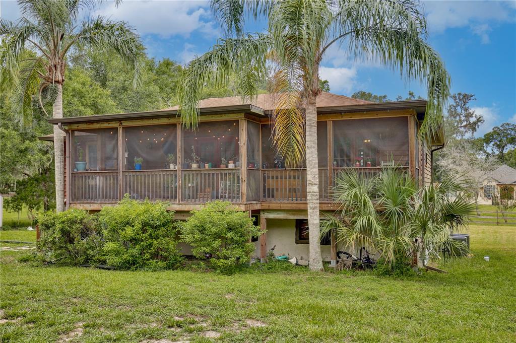 425 Mercers Fernery Road DeLand, FL 32720 - Photo 6 of 54 a view of a back yard of the house