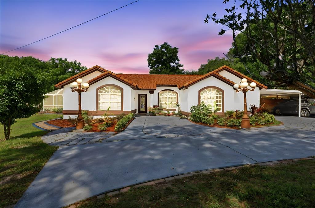 1898 Blackwelder Road De Leon Springs, FL 32130 - Photo 1 of 33 a front view of a house with garden