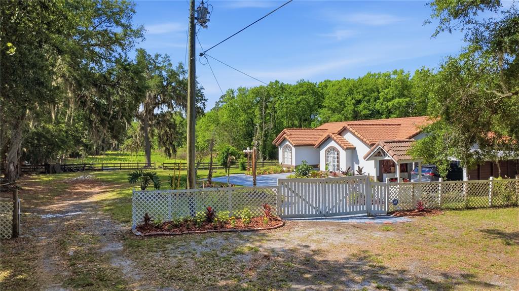 1898 Blackwelder Road De Leon Springs, FL 32130 - Photo 2 of 33 a view of a chair and table on the wooden floor