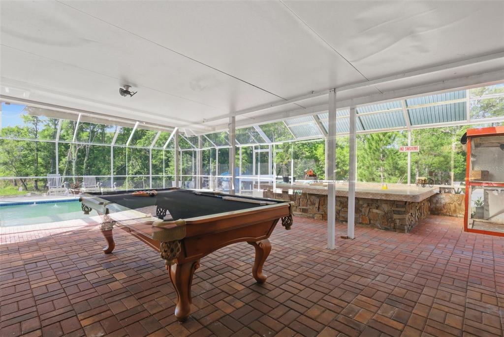 1898 Blackwelder Road De Leon Springs, FL 32130 - Photo 21 of 33 a swimming pool with outdoor seating and yard