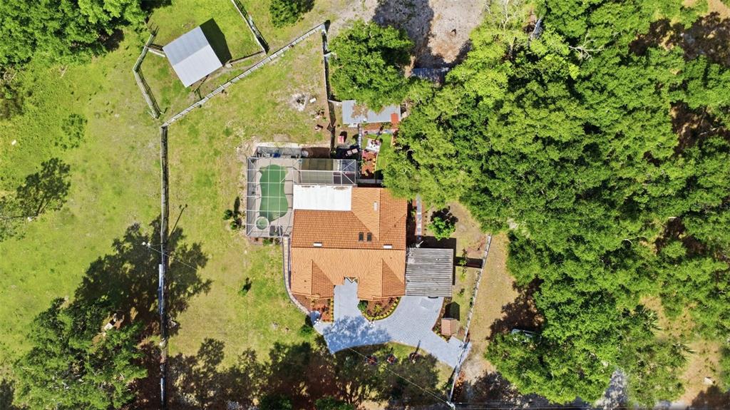 1898 Blackwelder Road De Leon Springs, FL 32130 - Photo 24 of 33 an aerial view of residential house with outdoor space and trees all around