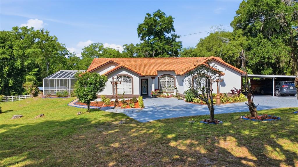 1898 Blackwelder Road De Leon Springs, FL 32130 - Photo 26 of 33 a view of house with outdoor space