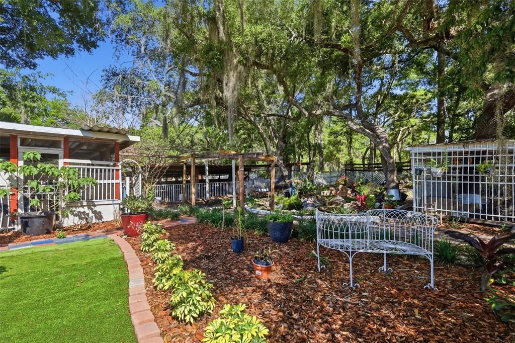 1898 Blackwelder Road De Leon Springs, FL 32130 - Photo 28 of 33 a garden view with a seating space