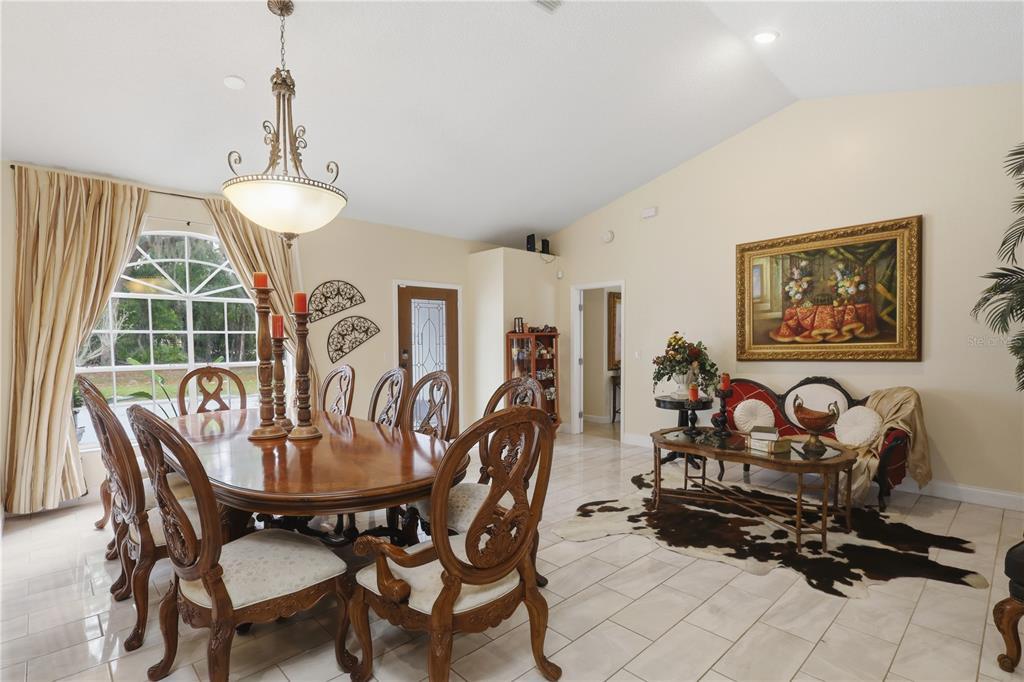 1898 Blackwelder Road De Leon Springs, FL 32130 - Photo 3 of 33 a view of a dining room with furniture window and outside view