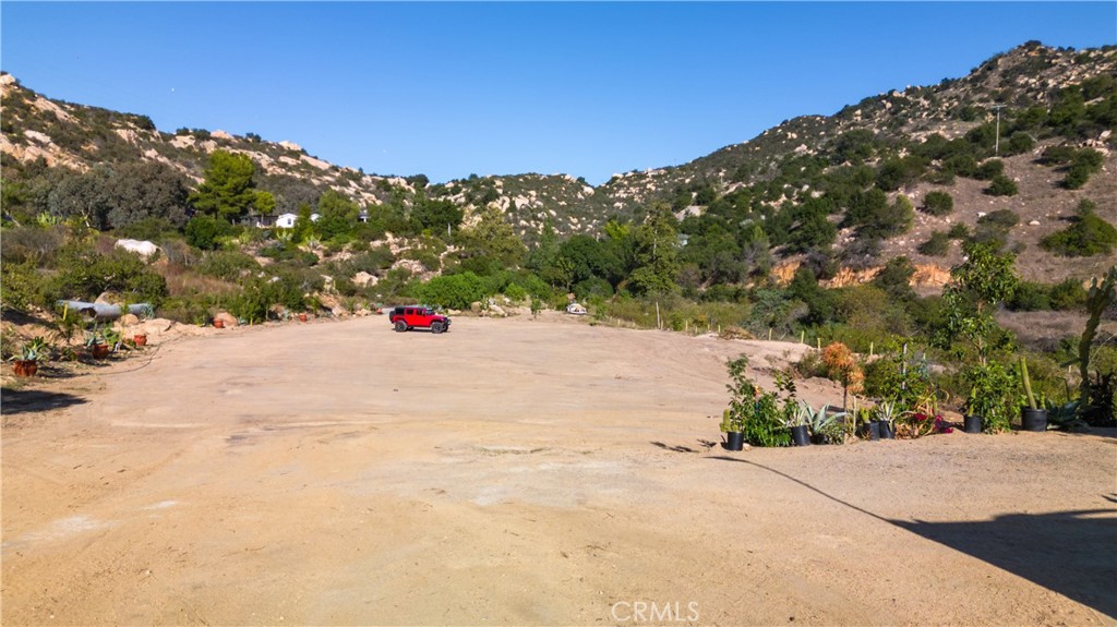 5589 Rainbow Creek Road Fallbrook, CA 92028 - Photo 9 of 15 a street view with mountains in the background