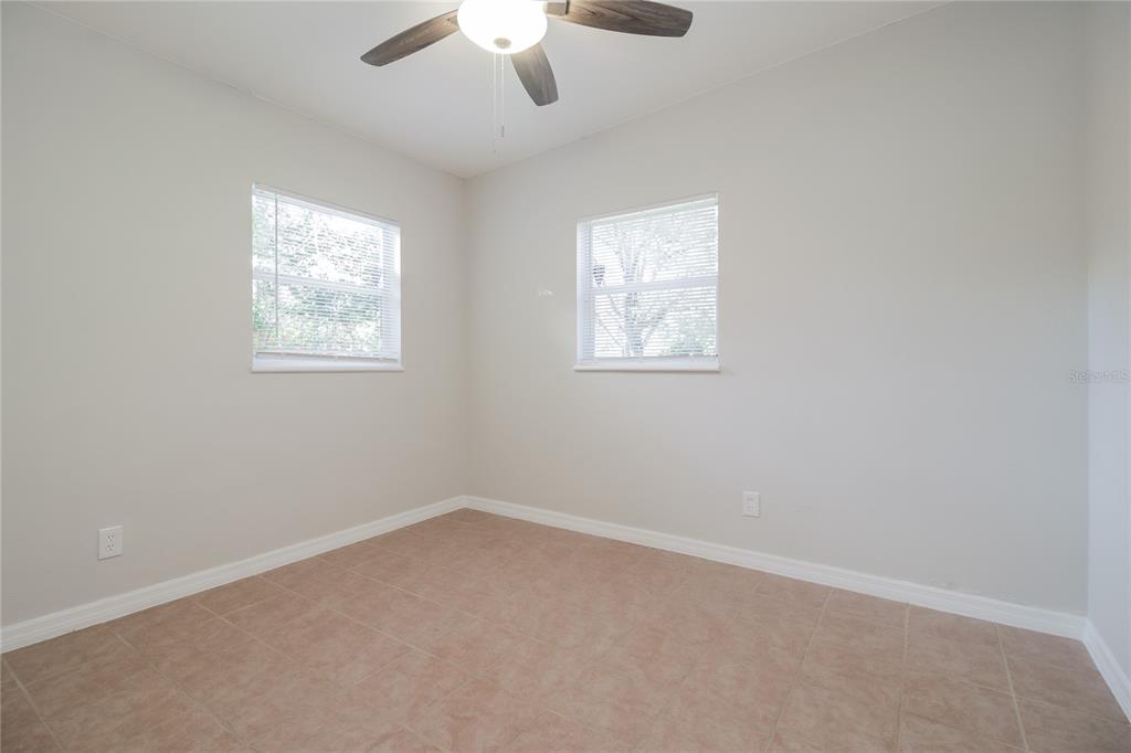 11623 Cameron Street Orlando, FL 32817 - Photo 10 of 16 an empty room with a window