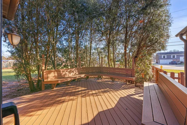 a yellow house with trees in front of it