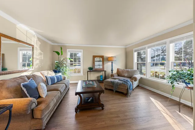 a living room with furniture and windows