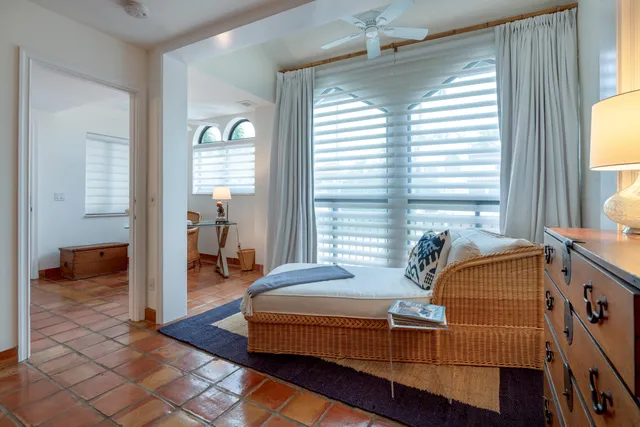 a living room with furniture and a lamp