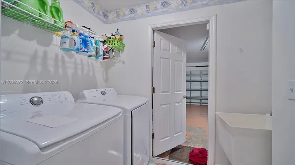 a spacious bedroom with a bed and a window