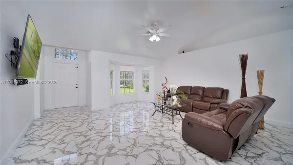 a living room with furniture and a window