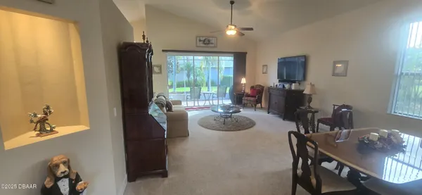 a view of a dining room with furniture window and outside view