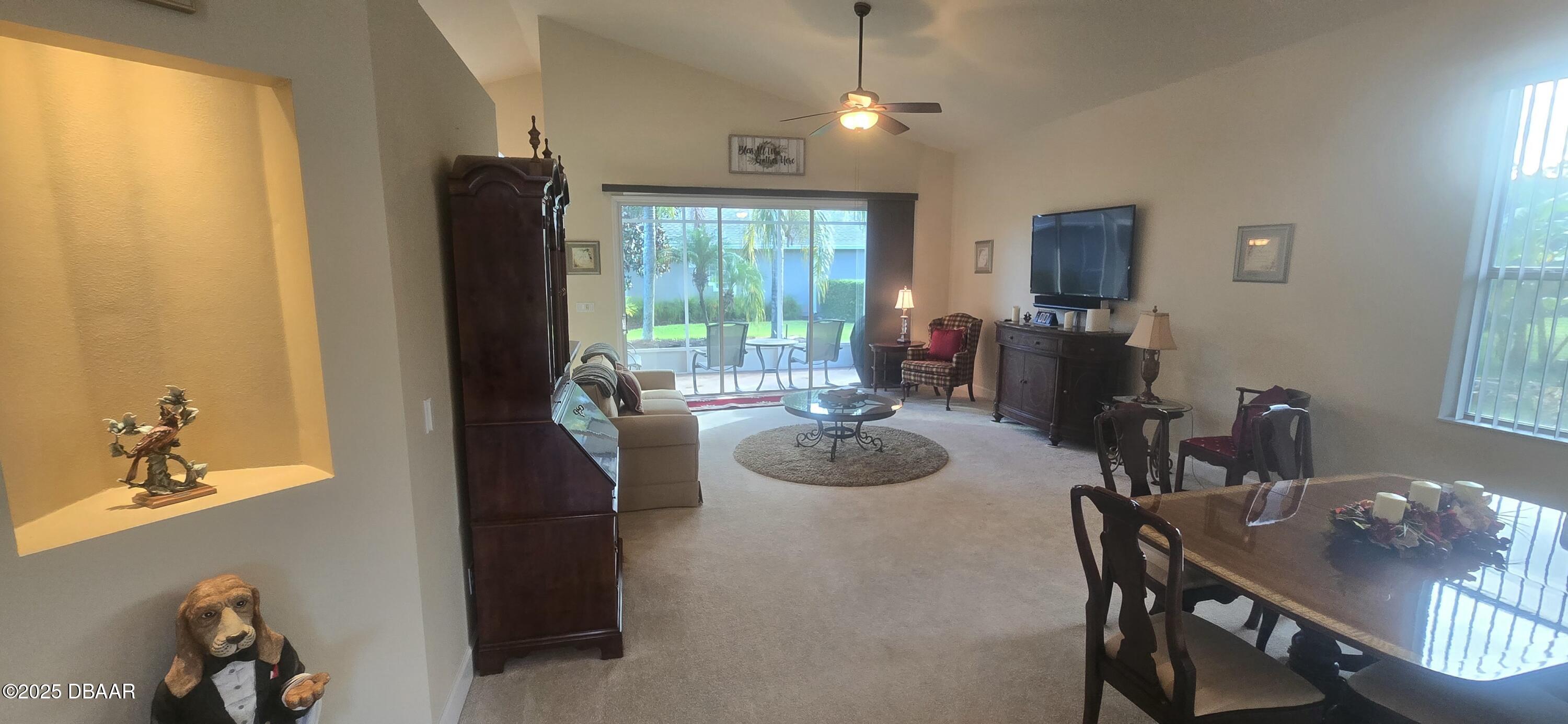 1279 Royal Pointe Lane Ormond Beach, FL 32174 - Photo 14 of 24 a view of a dining room with furniture window and outside view