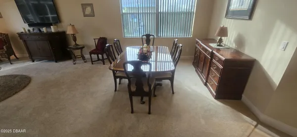 a view of a dining room with furniture