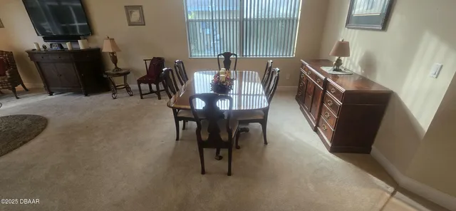 a view of a dining room with furniture