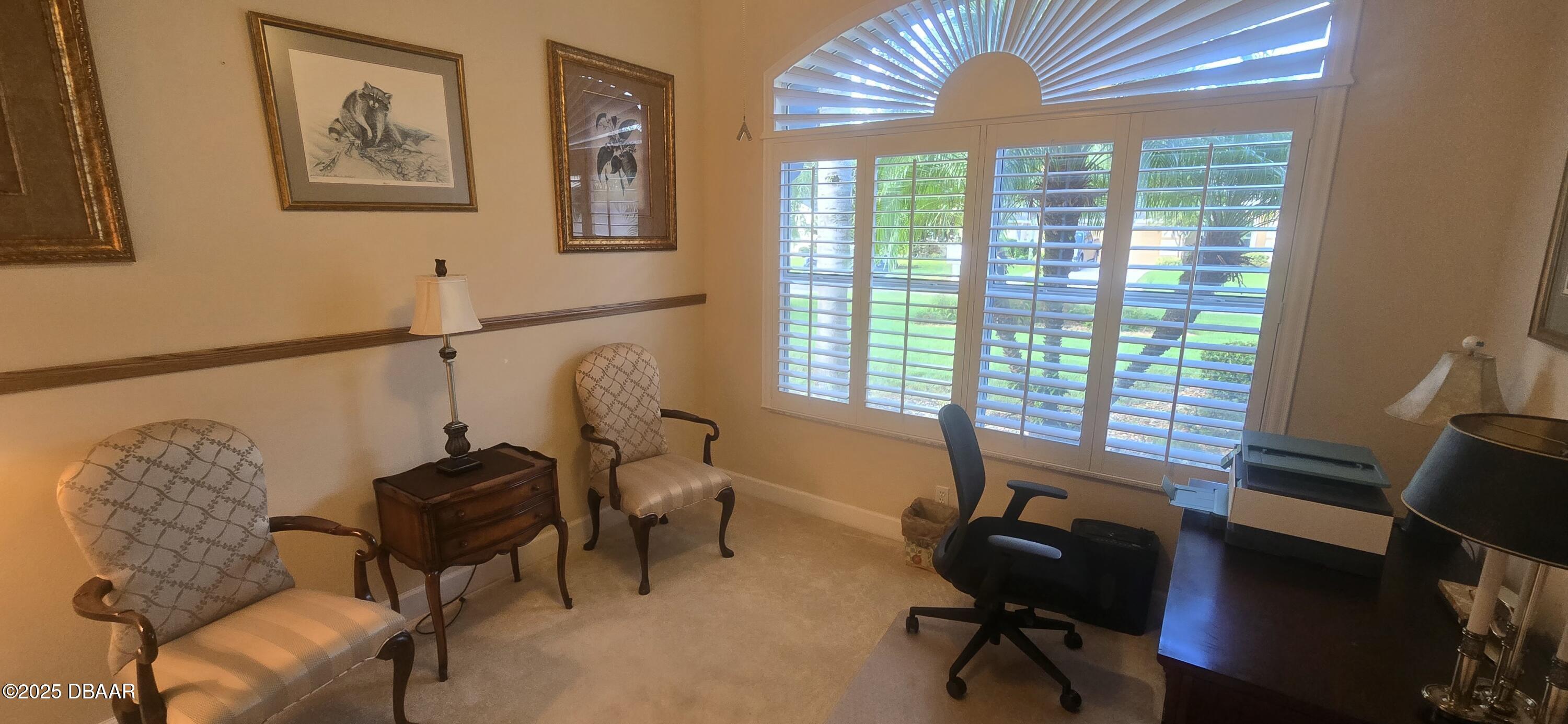 1279 Royal Pointe Lane Ormond Beach, FL 32174 - Photo 18 of 24 a view of a livingroom with workspace and a window