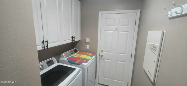 a utility room with dryer and washer