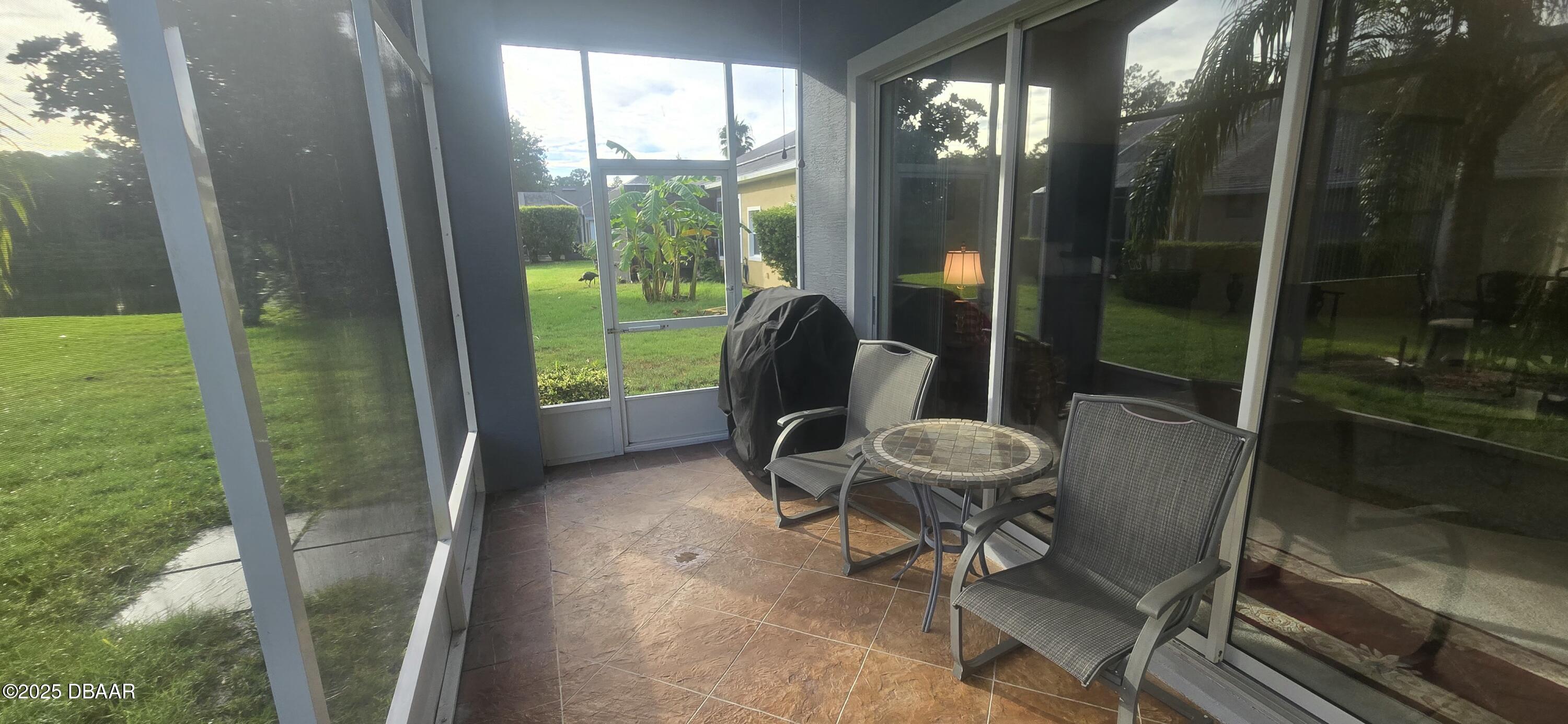 1279 Royal Pointe Lane Ormond Beach, FL 32174 - Photo 22 of 24 a view of a chairs in balcony
