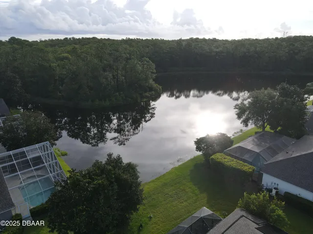a view of a lake with a yard