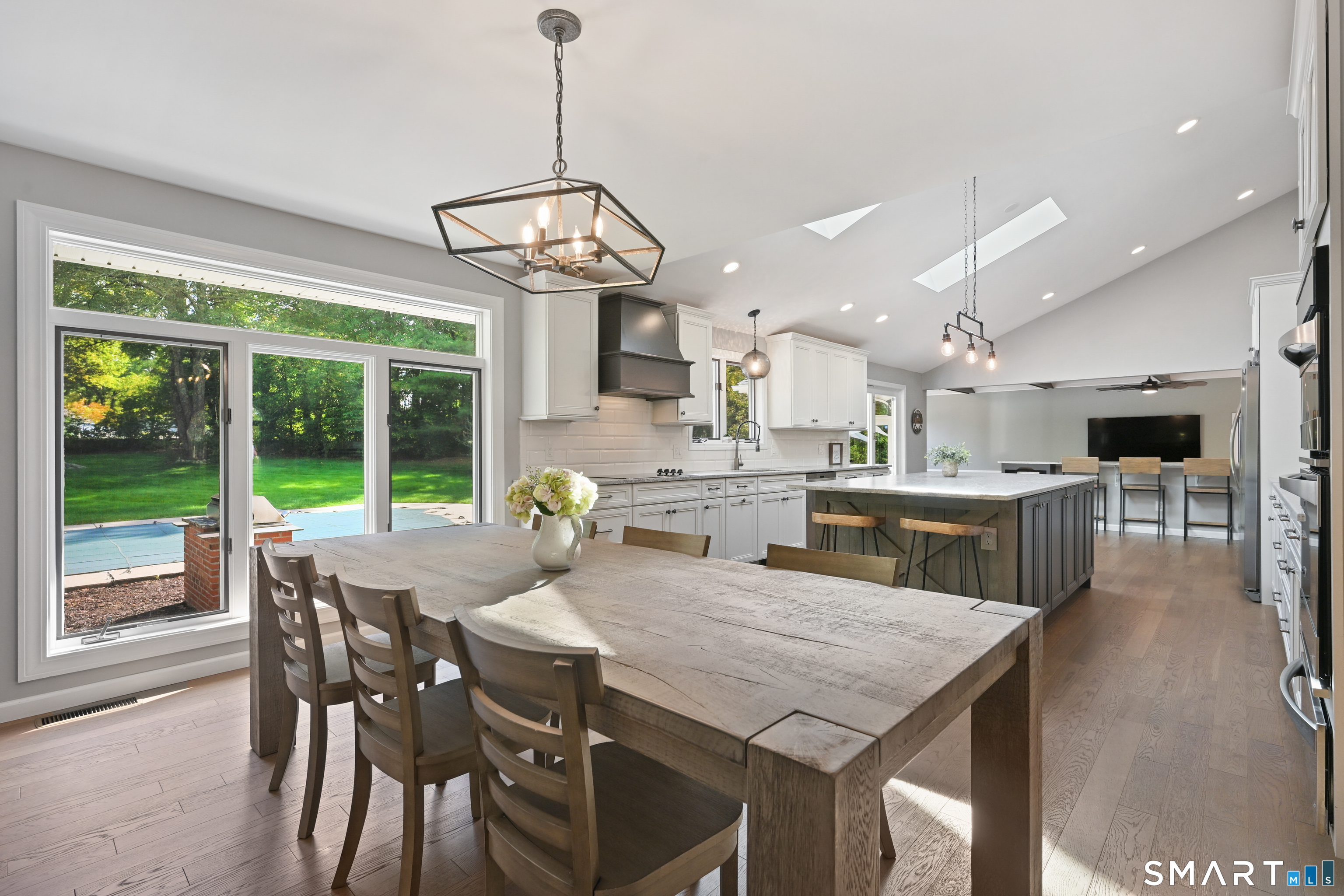 66 Heather Road Monroe, CT 06468 - Photo 12 of 40 a view of a dining room with furniture wooden floor and chandelier