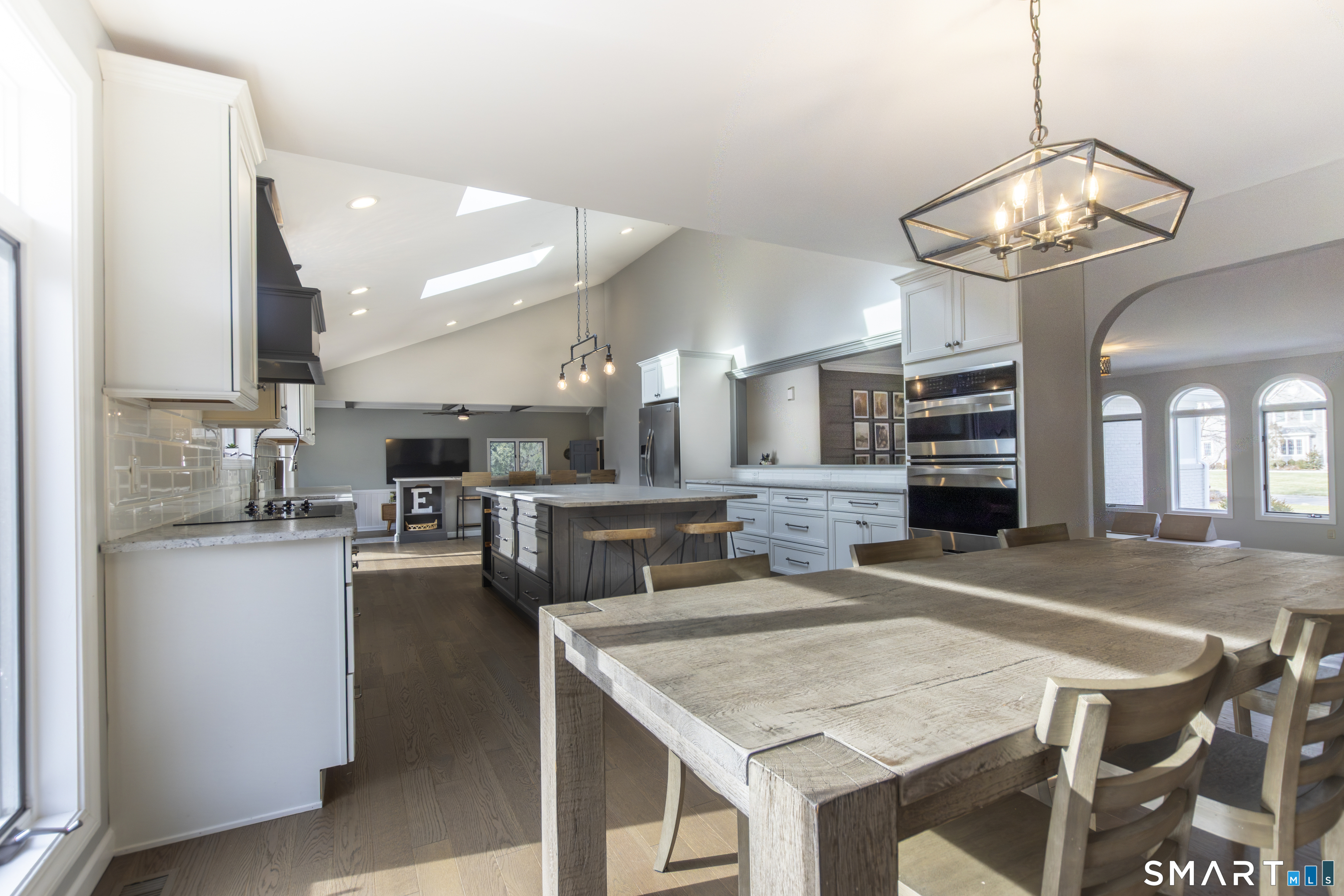 66 Heather Road Monroe, CT 06468 - Photo 13 of 40 a kitchen with a table and chairs in it