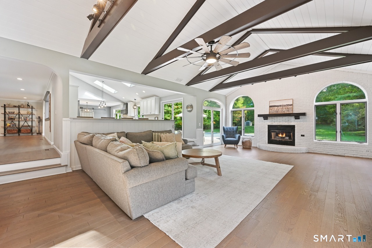 66 Heather Road Monroe, CT 06468 - Photo 15 of 40 a living room with furniture and a fireplace