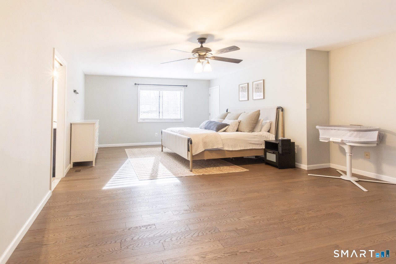 66 Heather Road Monroe, CT 06468 - Photo 21 of 40 a living room with furniture and a chandelier