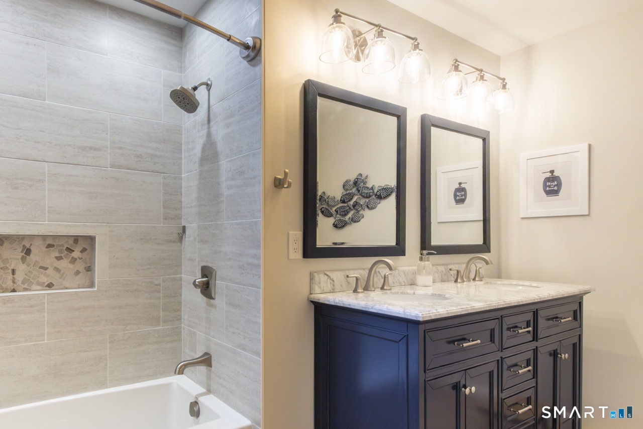 66 Heather Road Monroe, CT 06468 - Photo 27 of 40 a bathroom with a sink mirror toilet and bathtub