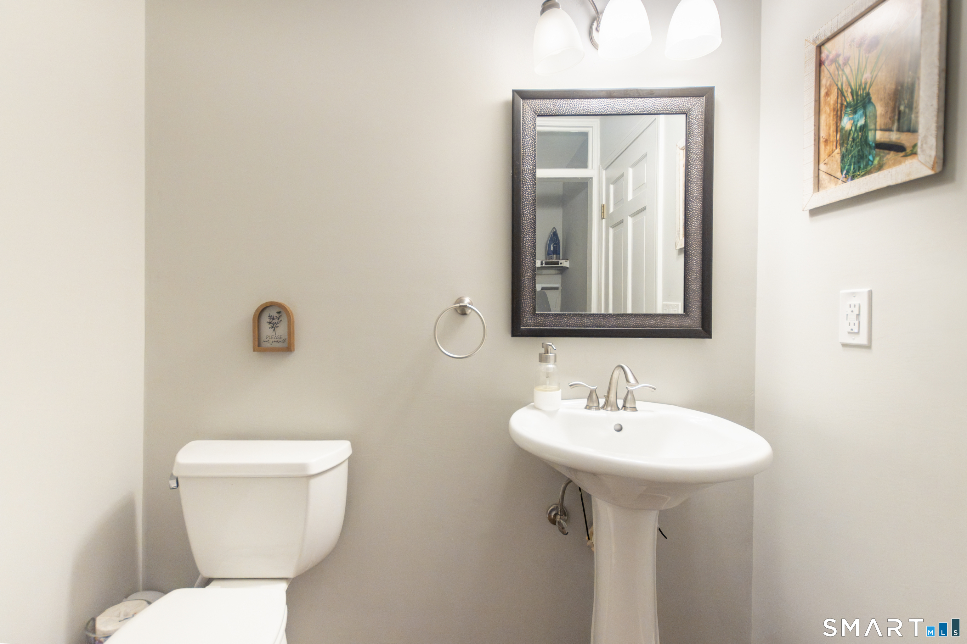 66 Heather Road Monroe, CT 06468 - Photo 28 of 40 a bathroom with a toilet sink and mirror