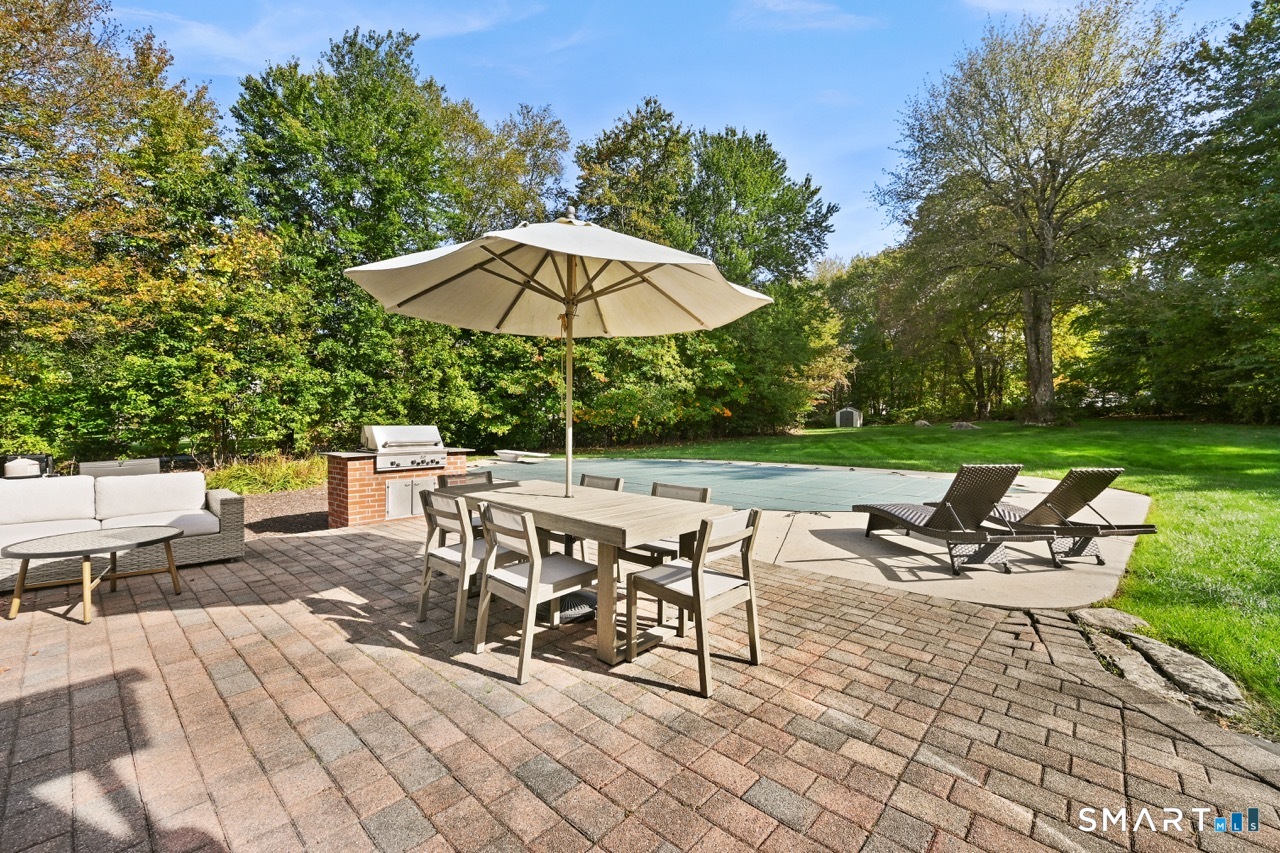 66 Heather Road Monroe, CT 06468 - Photo 33 of 40 an outdoor space with patio and white umbrellas