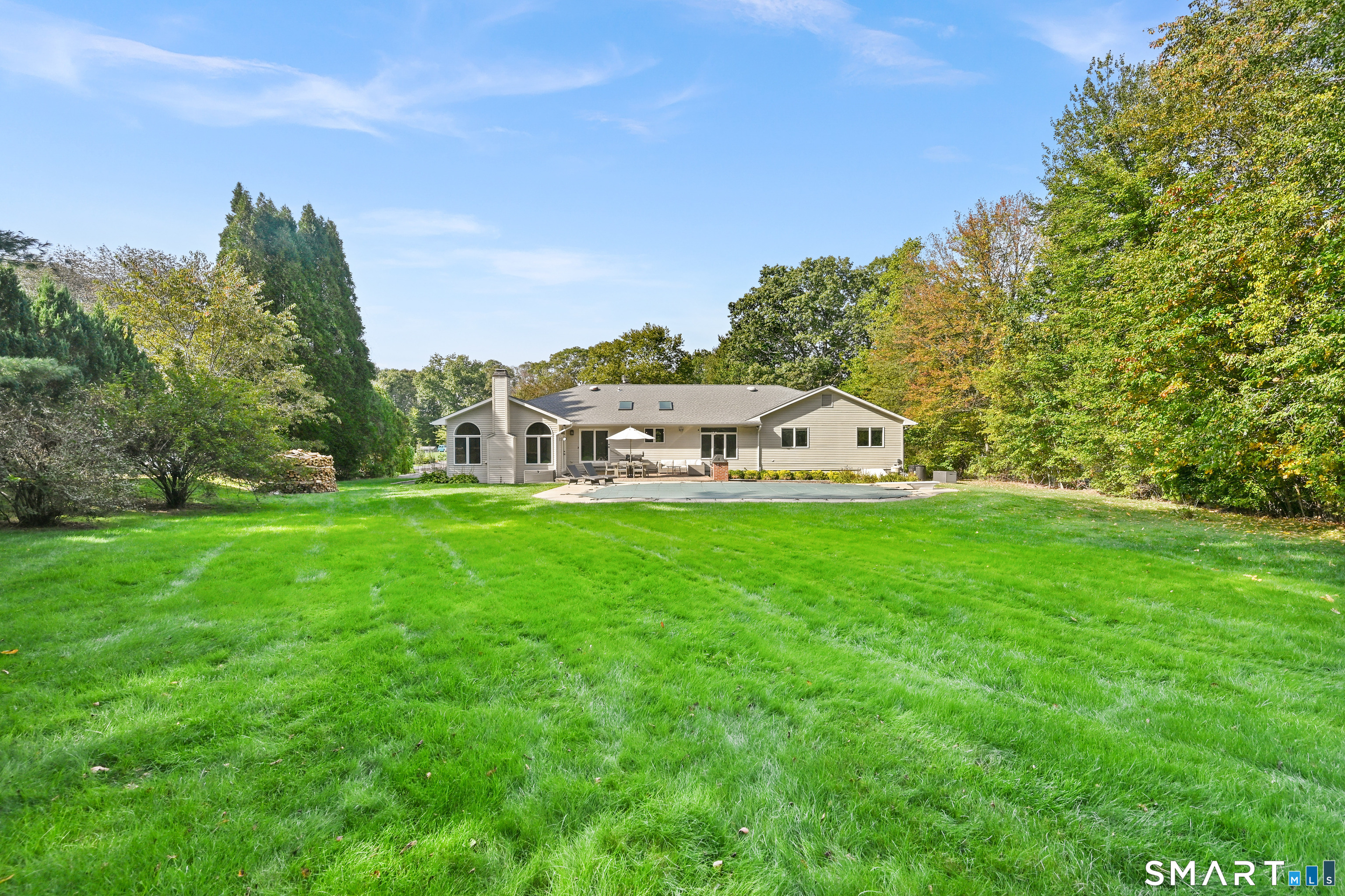 66 Heather Road Monroe, CT 06468 - Photo 35 of 40 a view of white house with a big yard and large trees