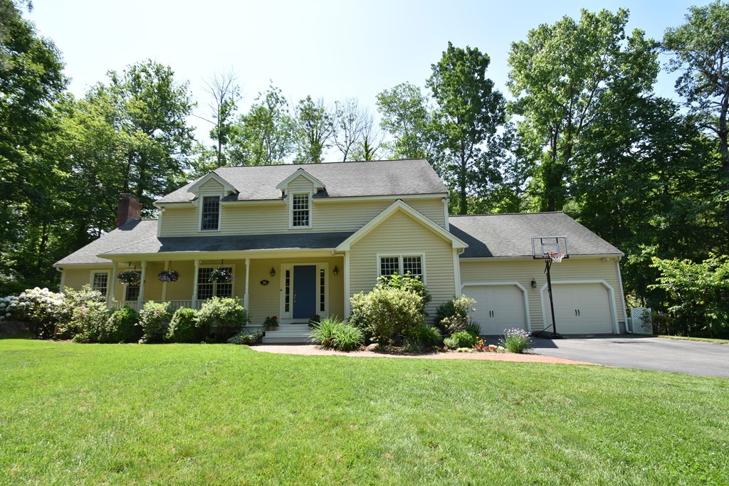 16 Wayside Inn Road Framingham, MA 01701 - Photo 1 of 30 a front view of a house with a garden and plants