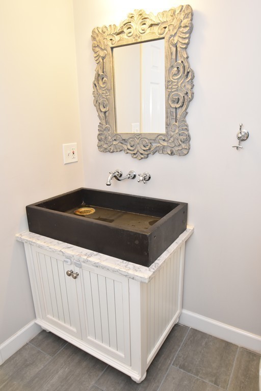 16 Wayside Inn Road Framingham, MA 01701 - Photo 12 of 30 a utility room with a sink and a mirror