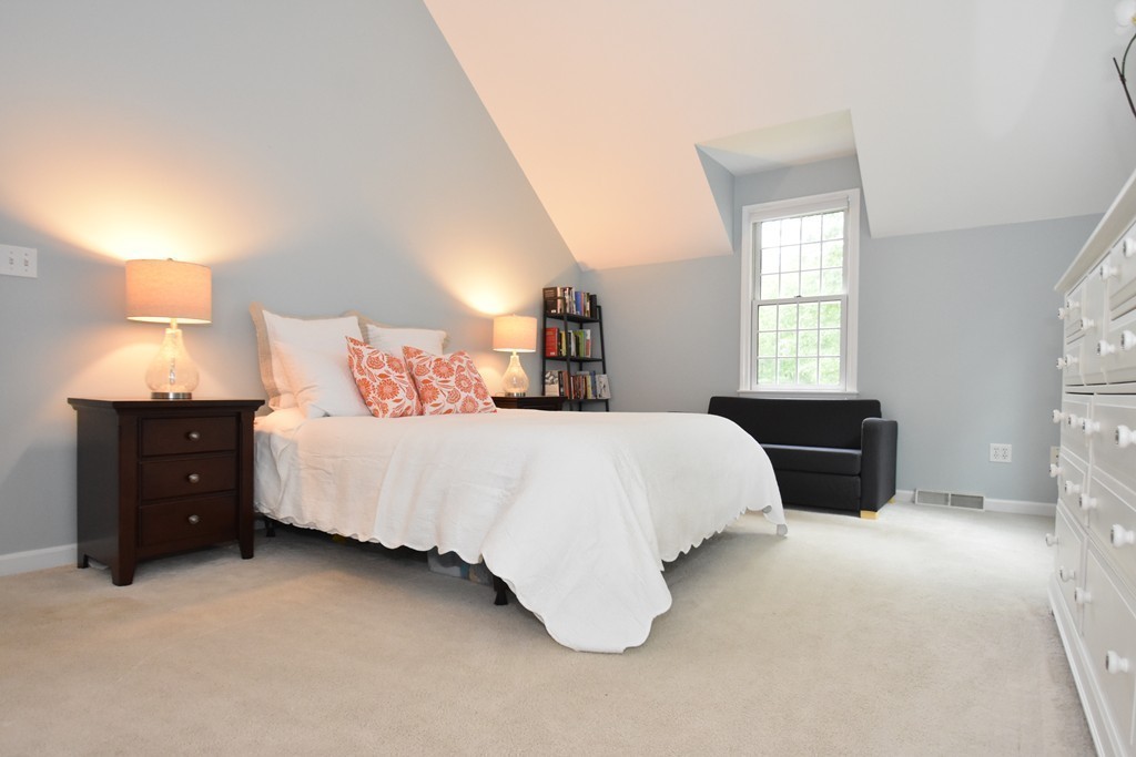 16 Wayside Inn Road Framingham, MA 01701 - Photo 17 of 30 a bed room with a bed and a tv