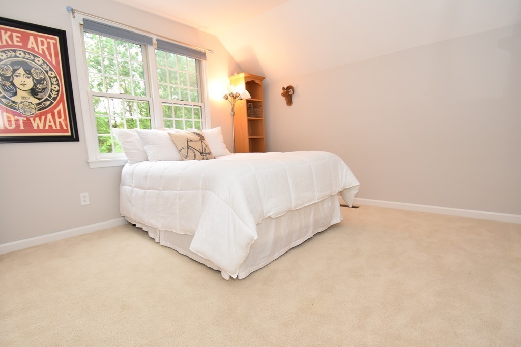 16 Wayside Inn Road Framingham, MA 01701 - Photo 19 of 30 a bed sitting in a bedroom next to a window