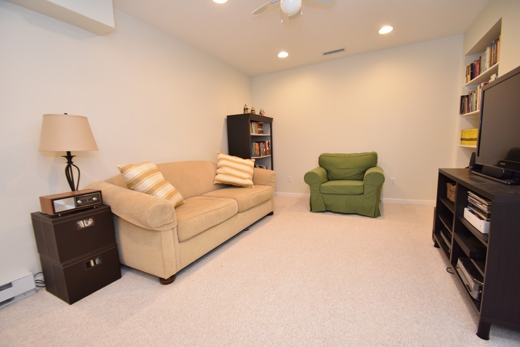 16 Wayside Inn Road Framingham, MA 01701 - Photo 27 of 30 a living room with furniture and a flat screen tv