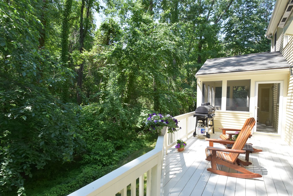16 Wayside Inn Road Framingham, MA 01701 - Photo 30 of 30 a view of a patio with table and chairs and wooden floor