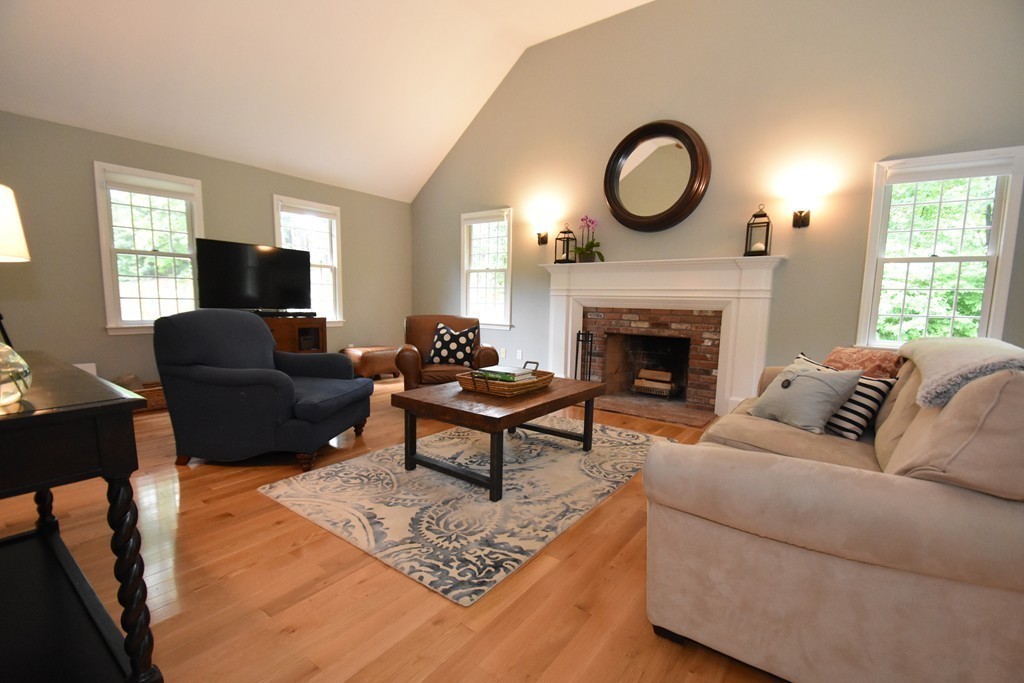 16 Wayside Inn Road Framingham, MA 01701 - Photo 5 of 30 a living room with furniture and a fireplace
