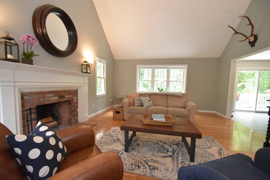 16 Wayside Inn Road Framingham, MA 01701 - Photo 7 of 30 a living room with furniture a window and a fireplace