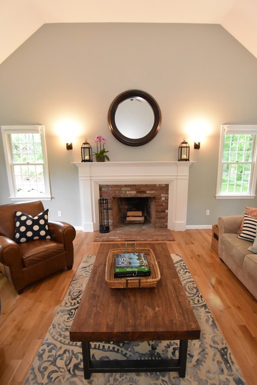 16 Wayside Inn Road Framingham, MA 01701 - Photo 8 of 30 a living room with furniture and a fireplace