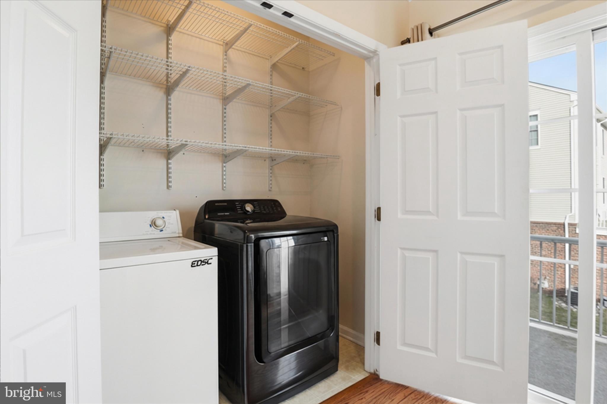 25114 Monteith Terrace Chantilly, VA 20152 - Photo 17 of 46 a view of hallway with washer and dryer