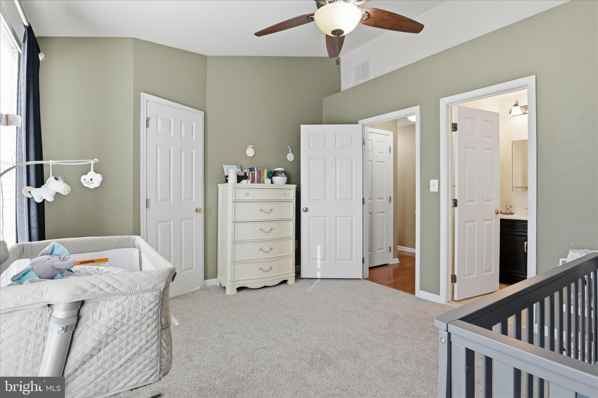 25114 Monteith Terrace Chantilly, VA 20152 - Photo 24 of 46 a bedroom with a bed and a chandelier