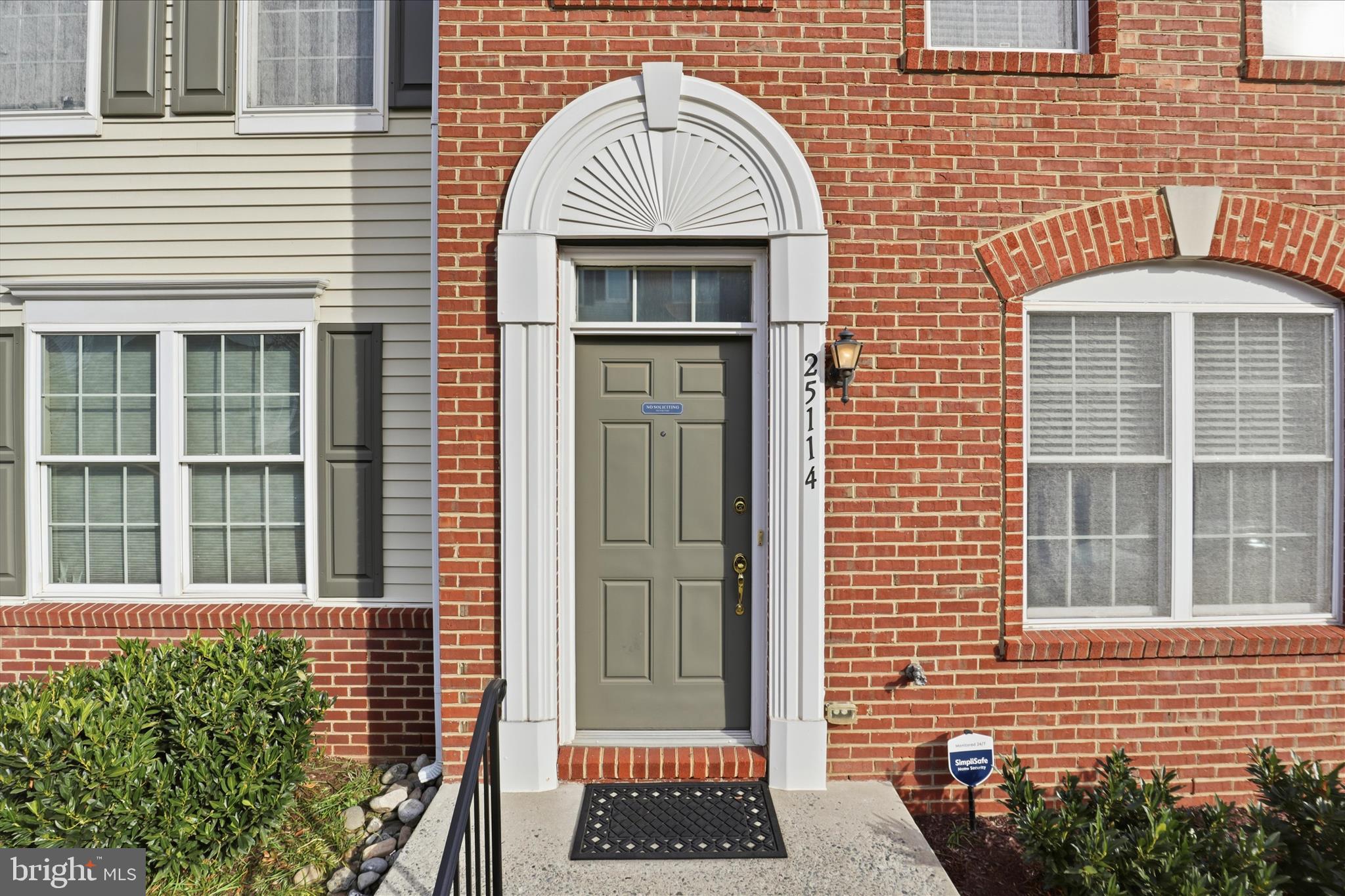 25114 Monteith Terrace Chantilly, VA 20152 - Photo 4 of 46 a front view of a house with a yard
